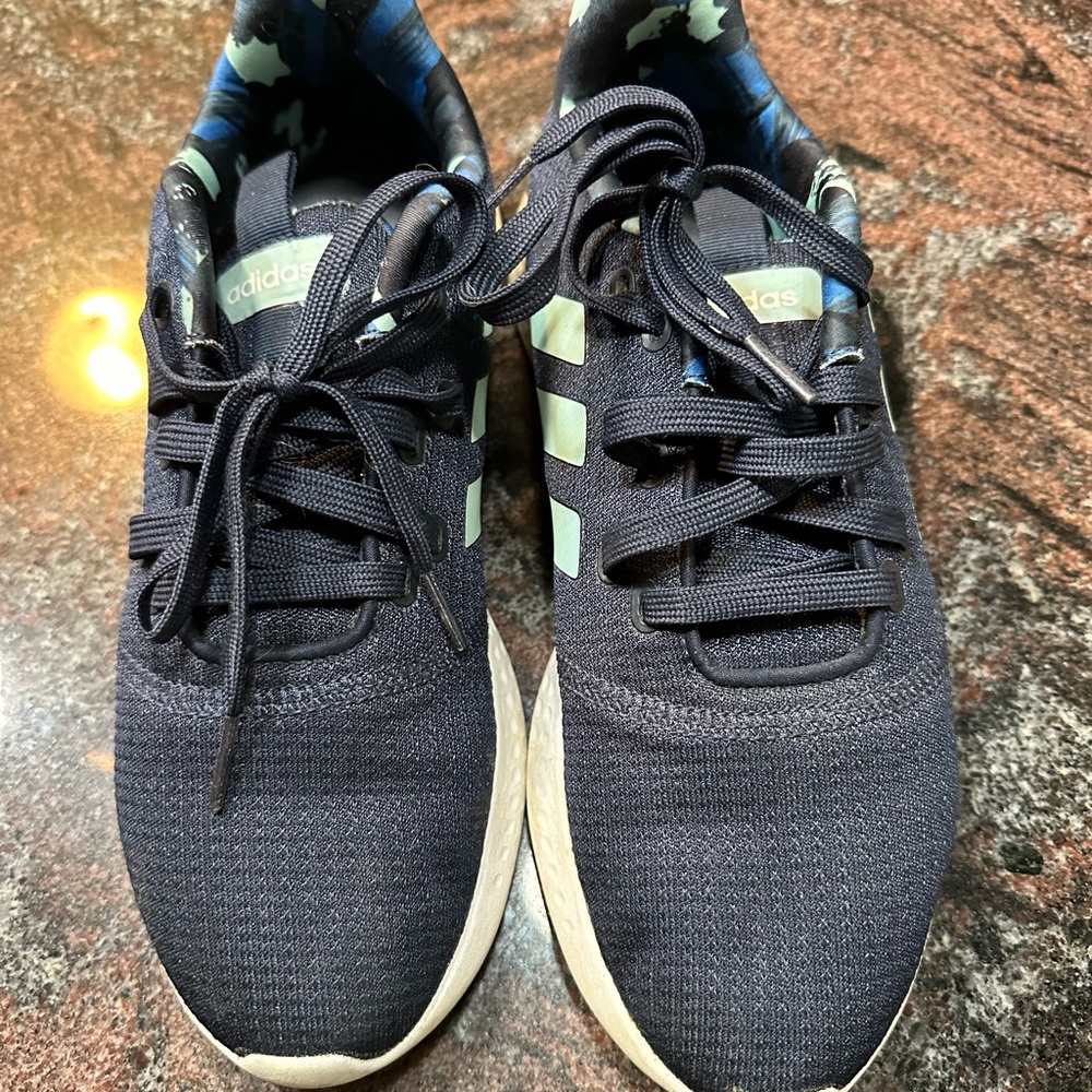Women’s size 9.5 navy blue Adidas sneakers.